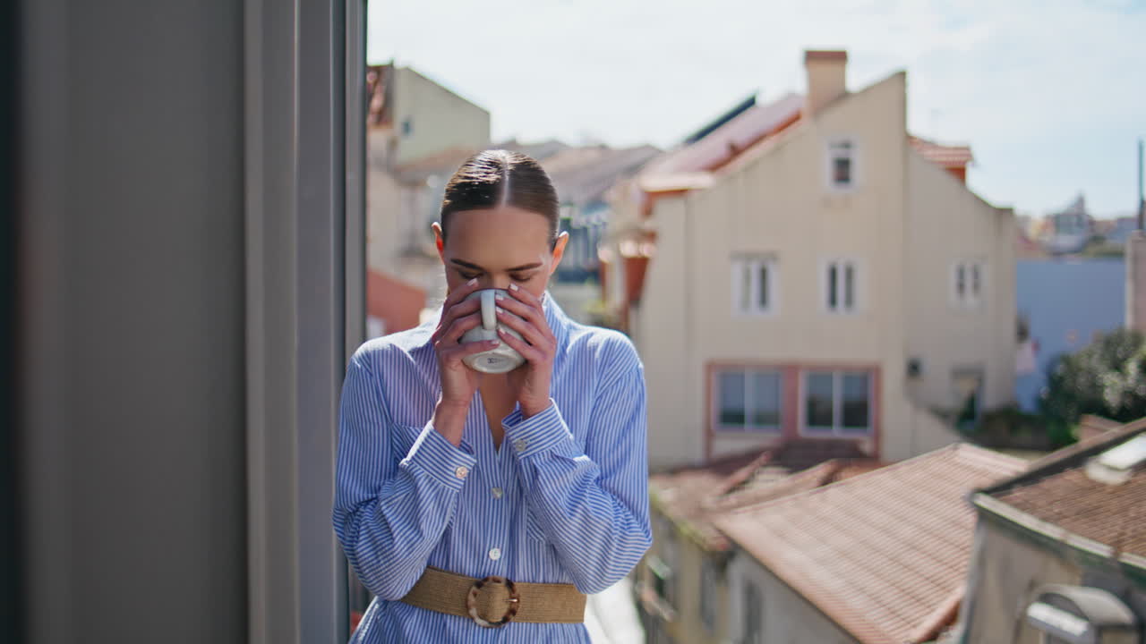 Tender woman drinking espresso at sunlight view balcony closeup. Girl relaxing