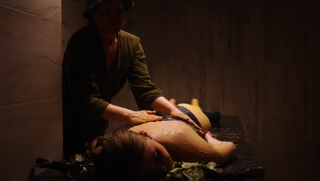 woman receiving a traditional back massage