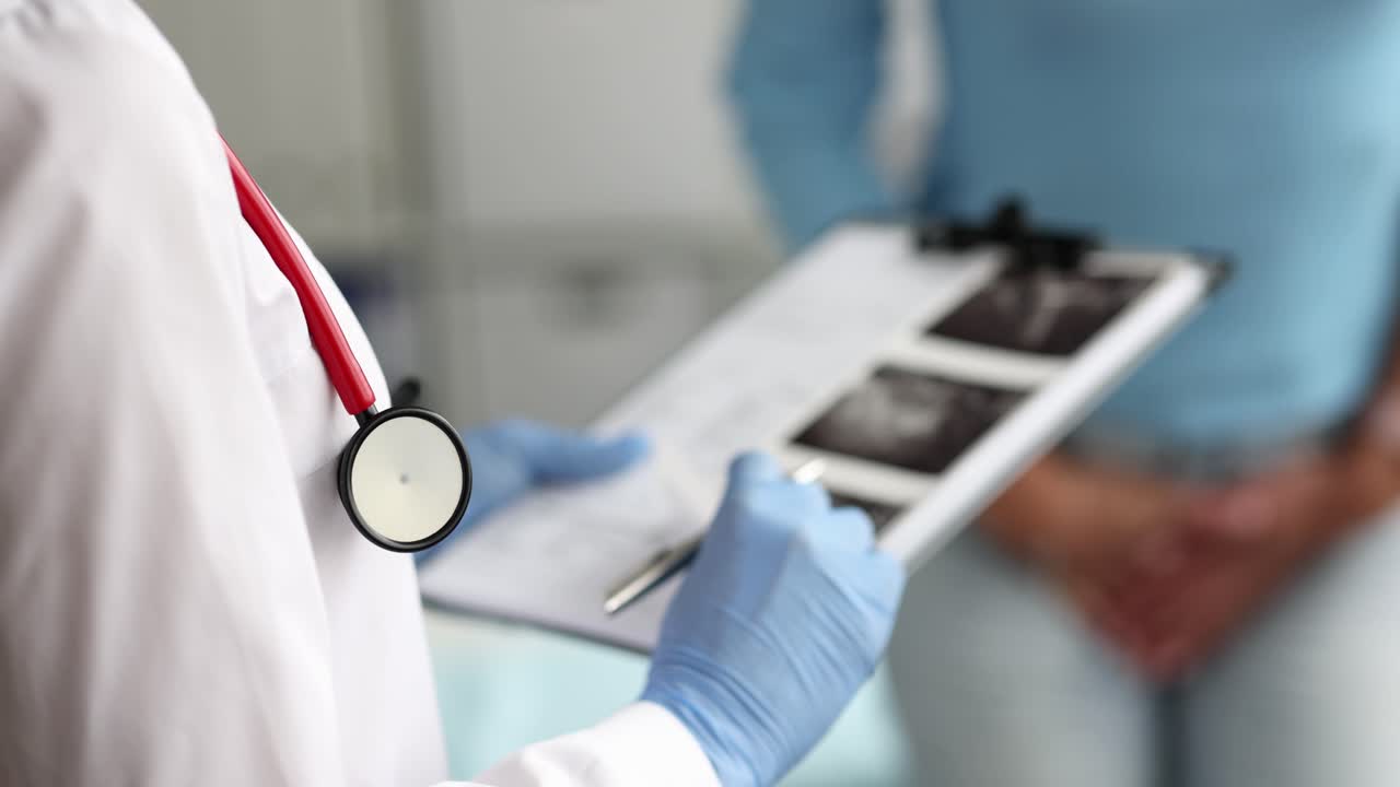 Uterus and ovary doctor holding ultrasound picture for diagnosis and treatment in hospital