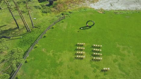 elegant wedding venue and empty chairs on meadow upper view