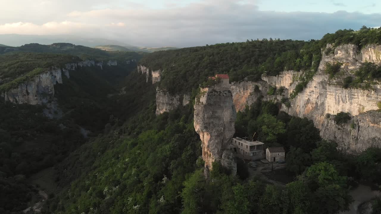 Aerial fly Katskhi Pillar Hermitage Dramatic Vertical Rock Formation in Georgia’s Highlands