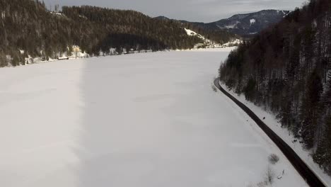 Drone-flight-over-frozen-lake-in-Austria