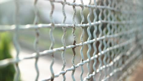moving-shot,-road-safety-wire-fence-with-background-blur