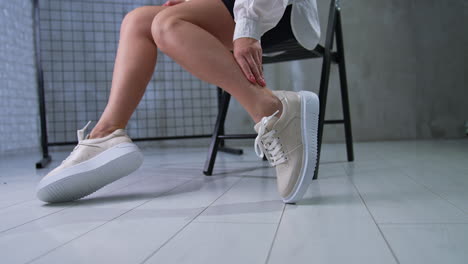 woman wearing beige platform sneakers
