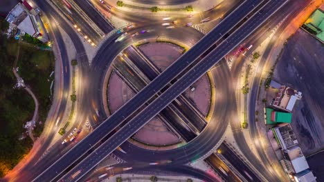 aerial view of traffic time lapse on intersection circle. busy traffic at night