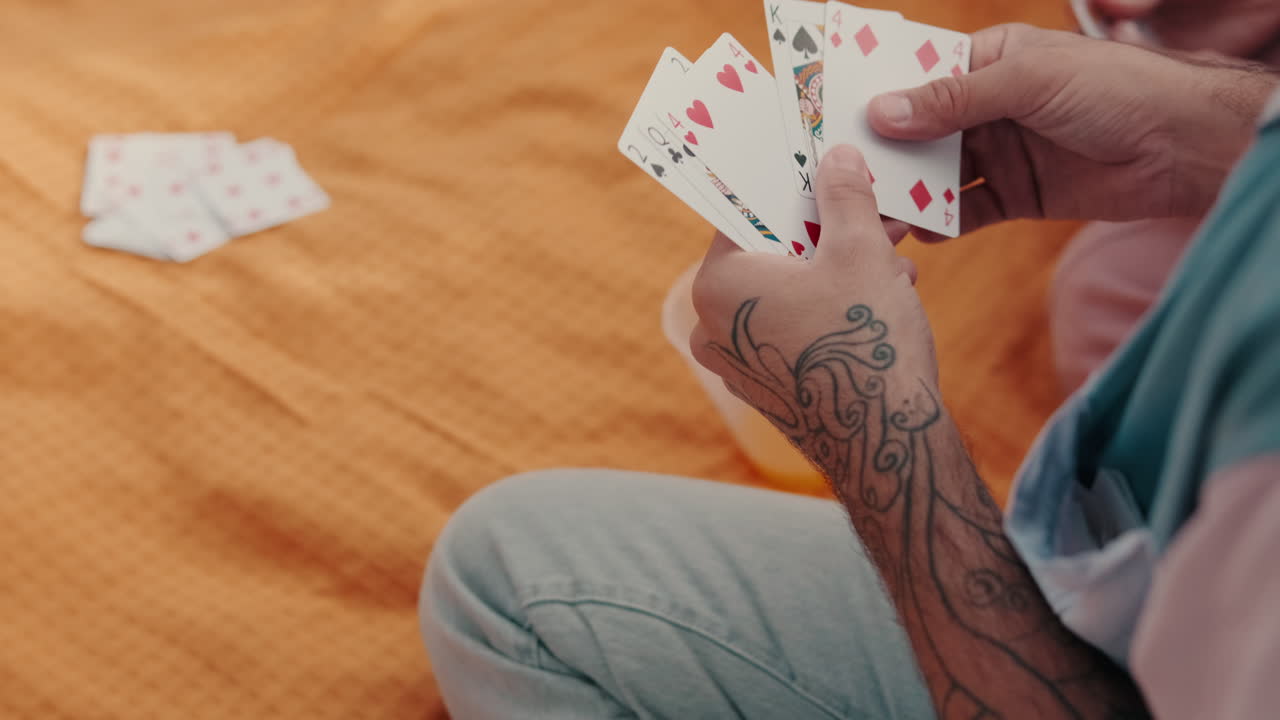 Friends Playing Cards at a Sunny Picnic