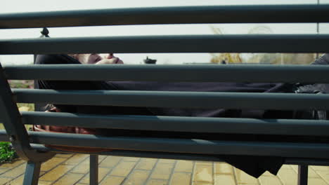outdoor bench is the perfect place to sleep for a young man