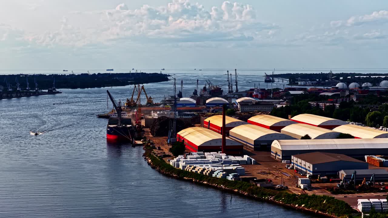 Aerial view of an industrial port by the river in soft afternoon light