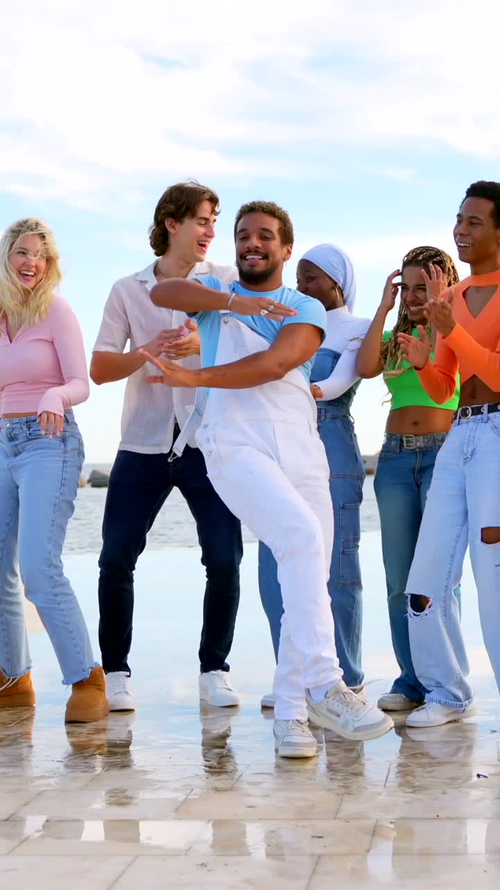 Group of Young Adults Dancing and Celebrating Outdoors