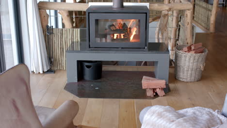 General-view-of-living-room-with-armchairs,-fireplace-and-window,-slow-motion