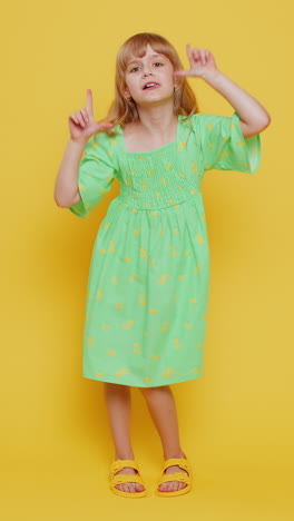 crazy blonde child girl kid making playful silly facial expressions fooling around showing tongue