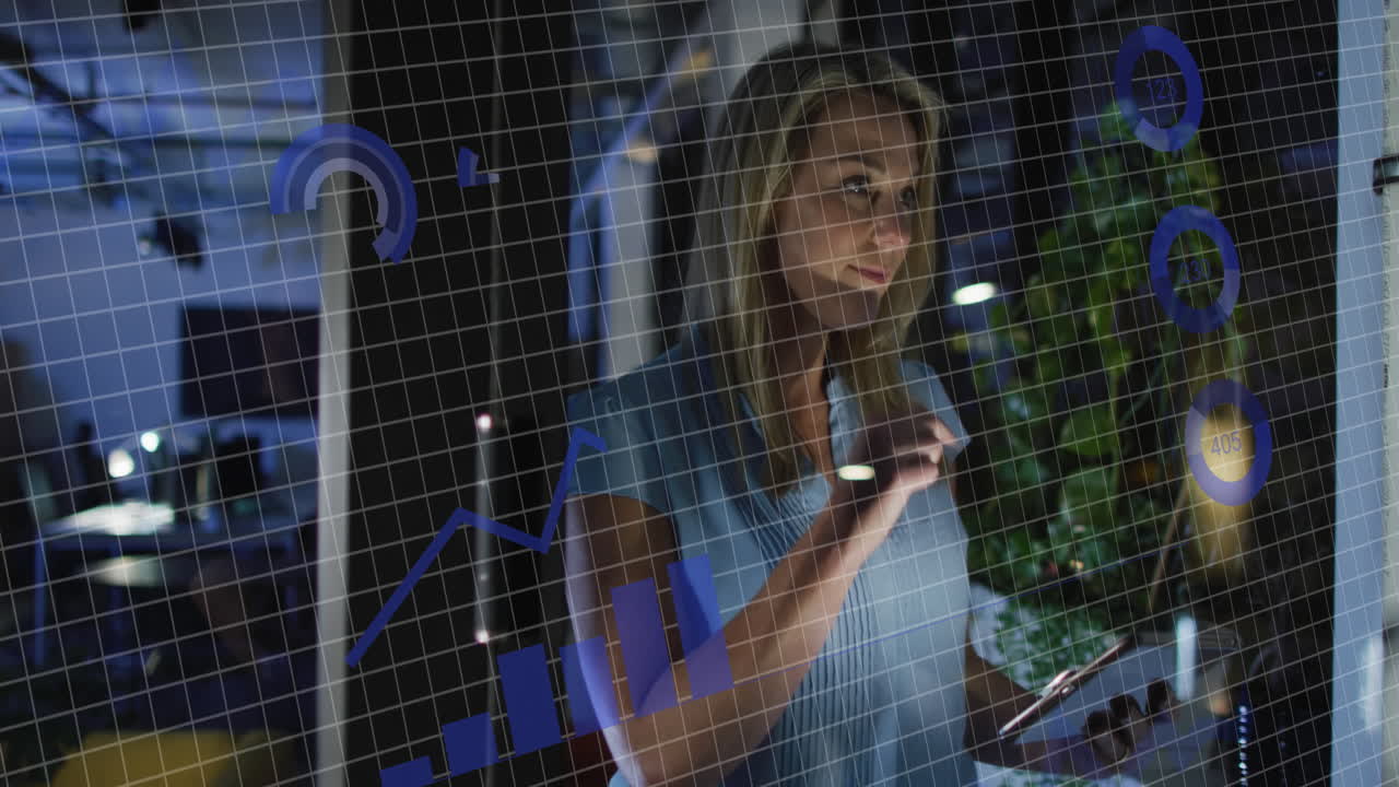 Animation of financial data processing over caucasian businesswoman working in office