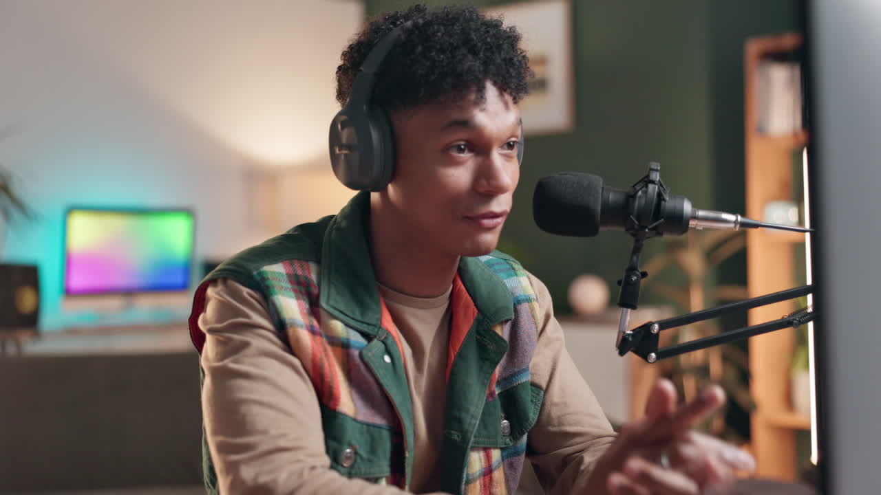 A man recording a podcast with a microphone and headphones