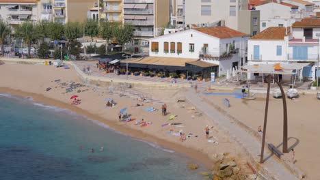 timelapse on the costa brava of girona blanes barcelona beach with people fast camera fixed shot turquoise blue sea