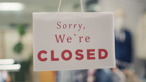 closed sign on fancy fashion boutique