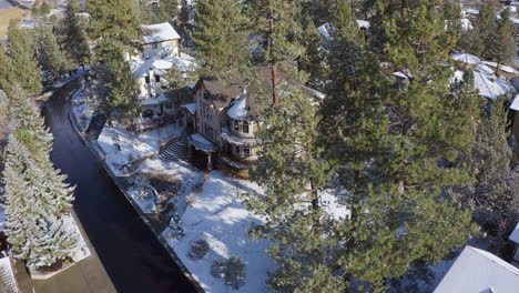 Aerial-Shot-of-Luxury-Residential-Town,-Snow-Covered-House-and-street-During-Winter-Christmas-Holidays