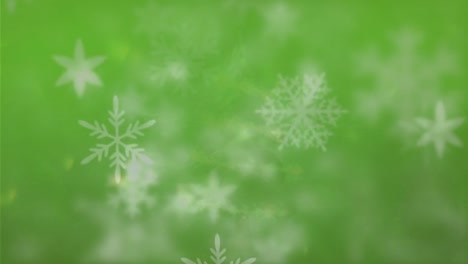 Animation-of-snowflakes-falling-over-green-background