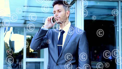 Animation-of-falling-euro-sign-over-businessman-using-smartphone