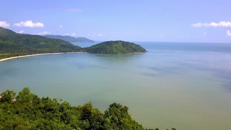 Da-Nang-Bay-beach-near-Hai-Van-Pass-in-Vietnam-on-a-sunny-calm-day,-Aerial-dolly-in-shot