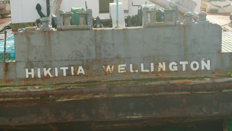 A-closeup-of-the-name-on-the-back-of-the-Hikitia-Wellington-ship-on-the-Wellington-waterfront,-New-Zealand