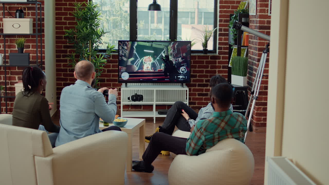 Multiethnic group of people playing video games and losing