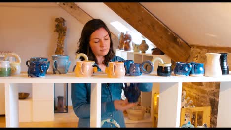 Woman-looking-at-earthenware-pot