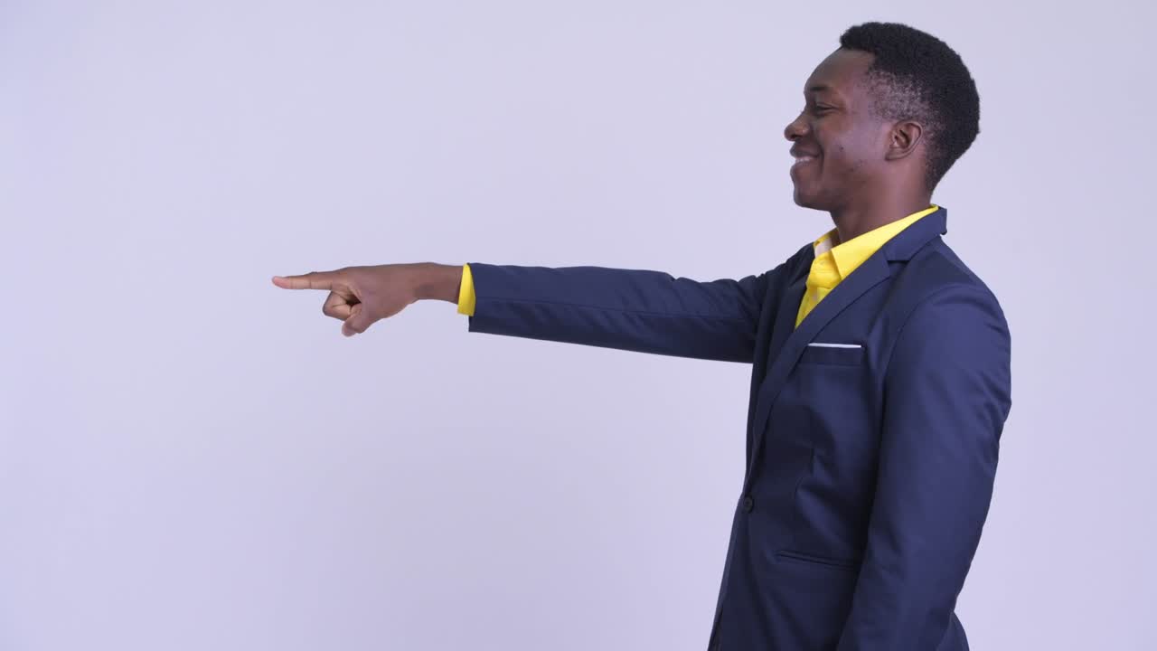 Young handsome African businessman in suit