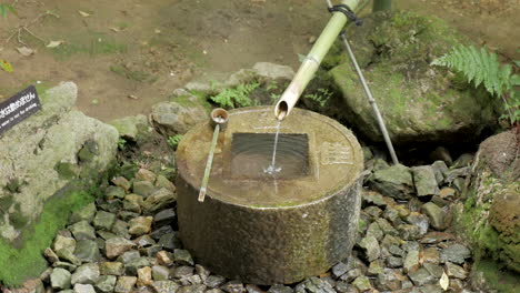 japanese fountain in a temple, japan