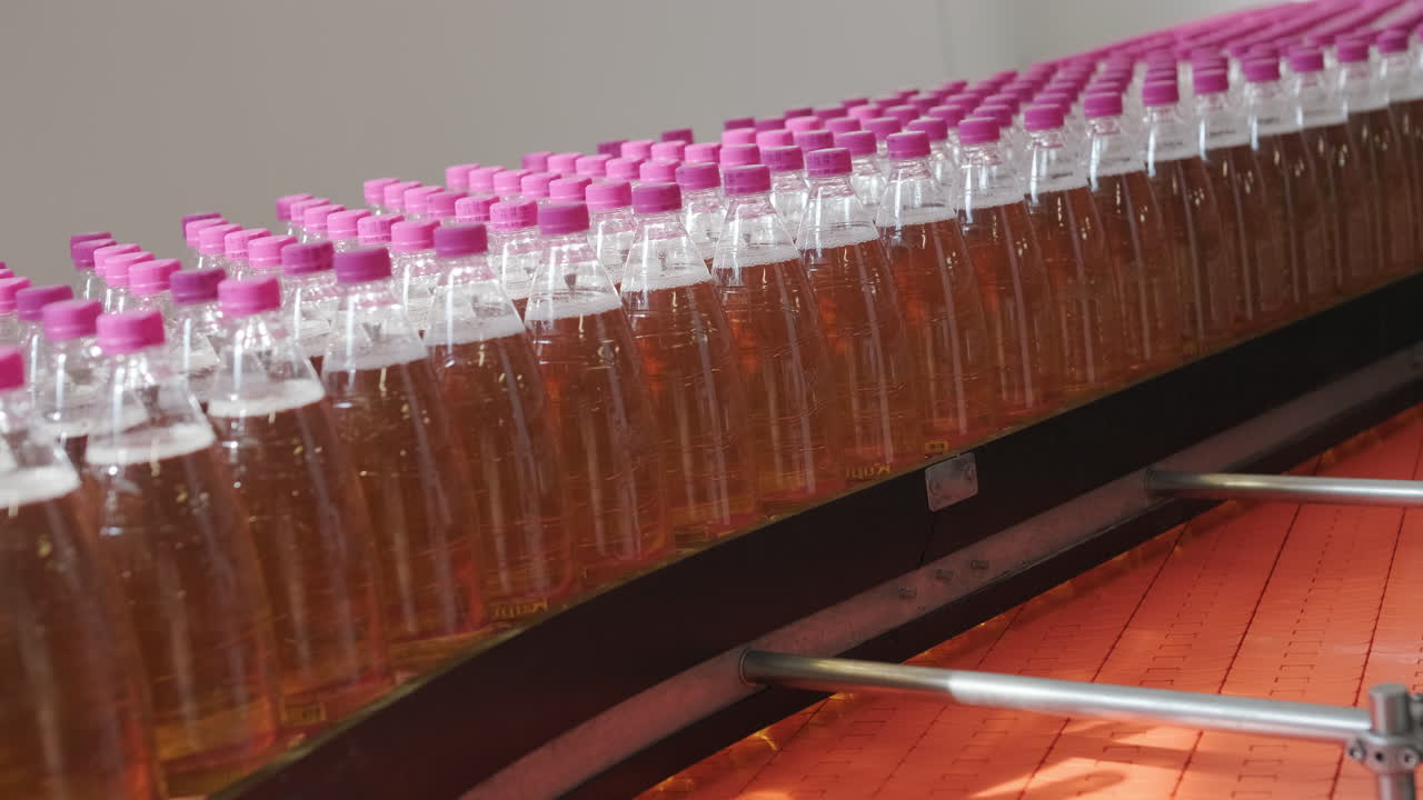 Bottles on a Conveyor Belt in a Beverage Production Facility