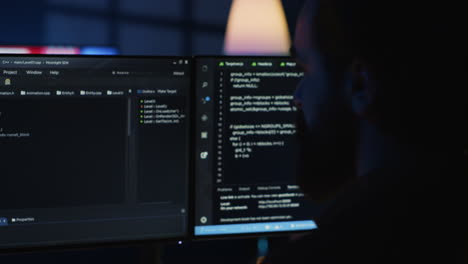 Software engineer writes complex binary code scripts on computer