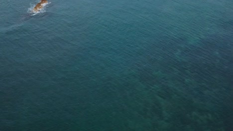 Drone-aerial-pan-down-surfers-waves-Hawaii