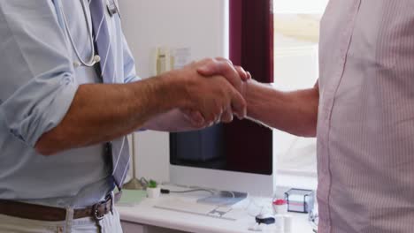 doctor examining a senior man in a retirement home