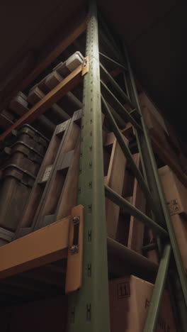 close-up view of a green metal shelving unit in a warehouse