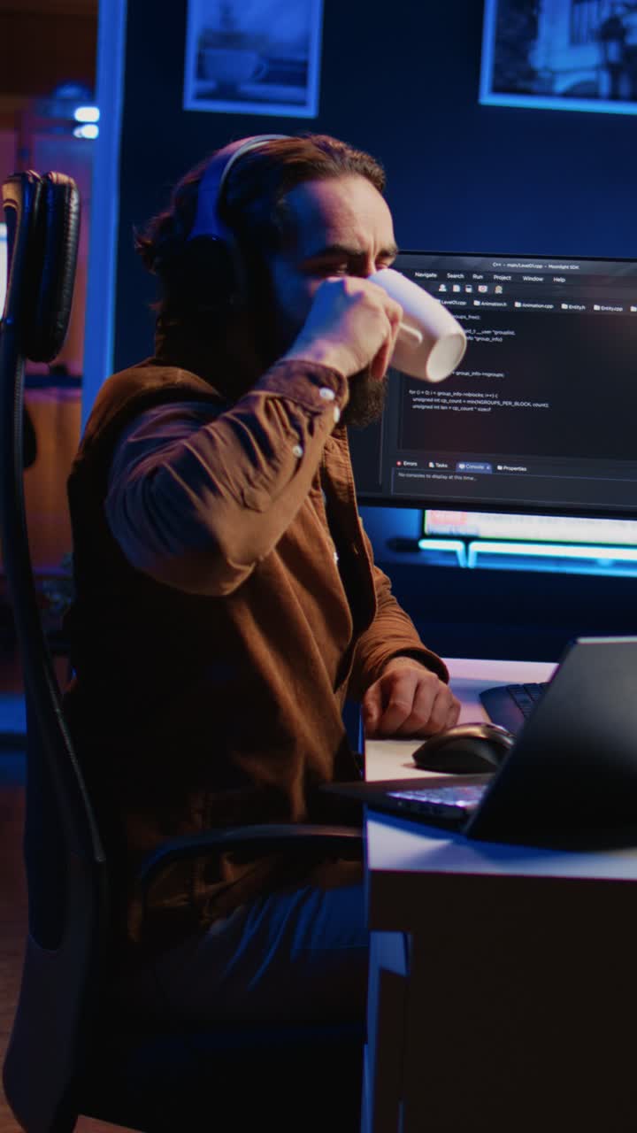 Focused Programmer Coding on Computer at Night in Home Office