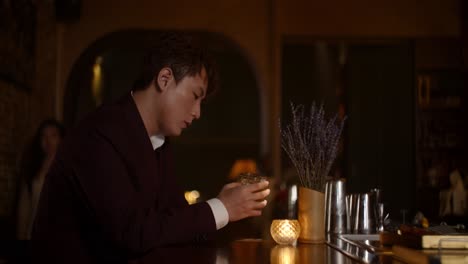 man sitting at a bar