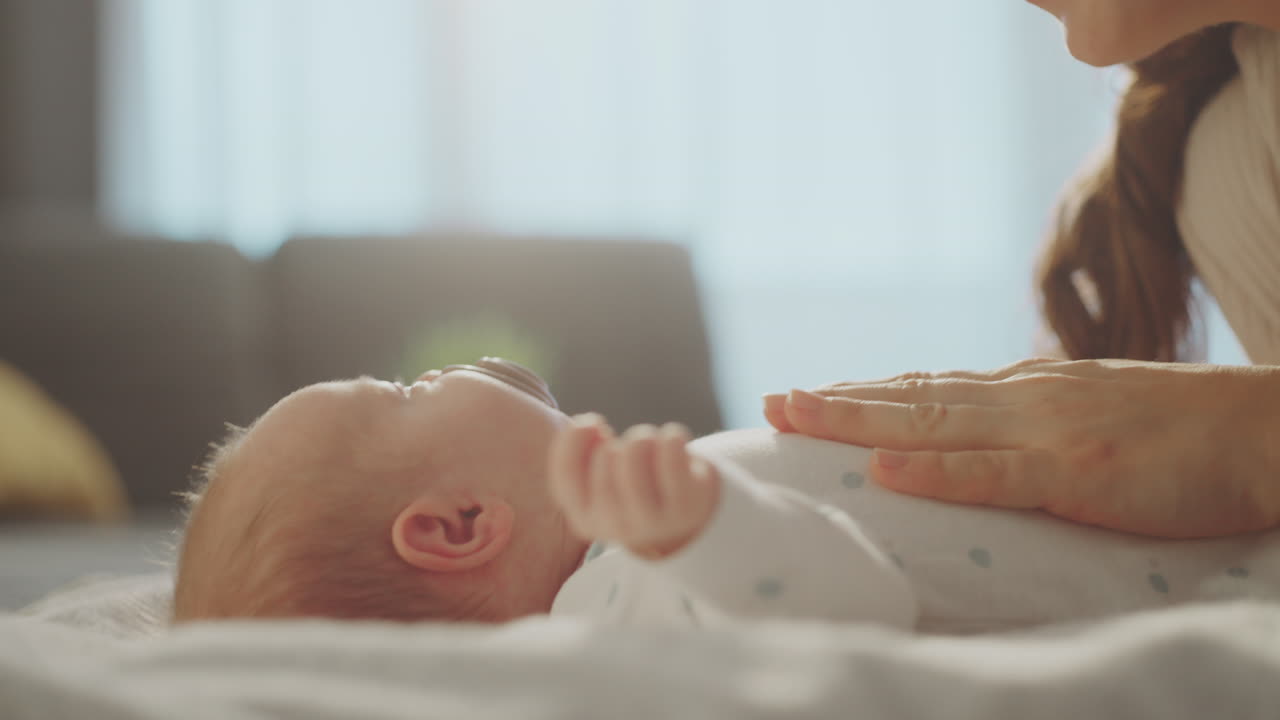 Mother Gently Caring for Baby