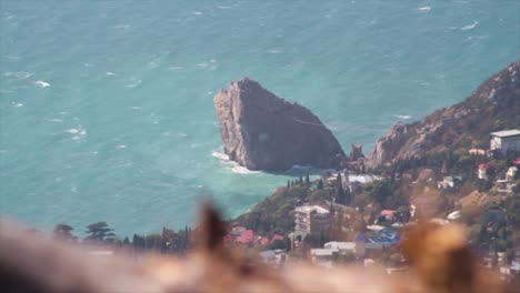 Rocky Coastline with City View