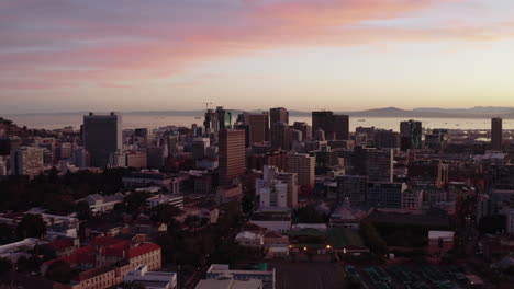 sunrise drone shot of city bowl in cape town, south africa