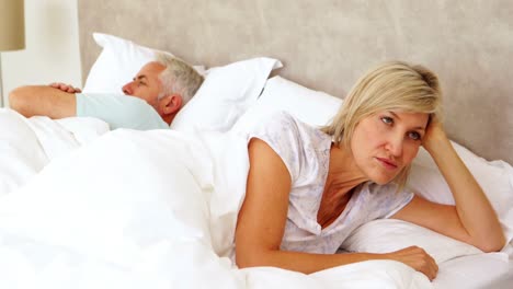 Couple-not-speaking-to-each-other-in-bed