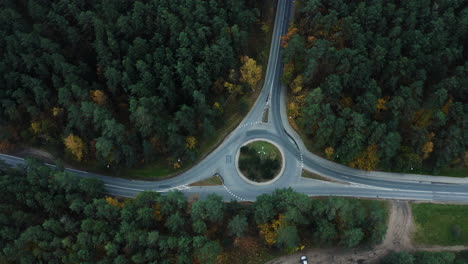 Static-aerial-view-of-roundabout-in-the-middle-of-the-woods