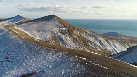 snowy mountains by the sea