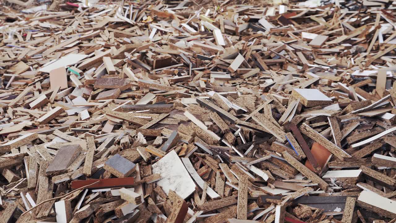 Garbage dump. Miscellaneous scraps of wood slabs. Furniture production waste. Environmental pollution