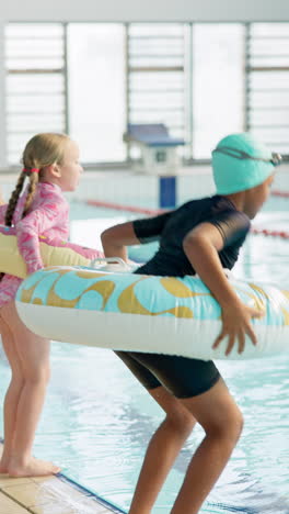 kids swimming in a pool