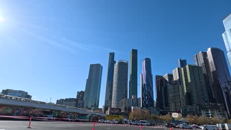 construction cones in parking lot with city skyline