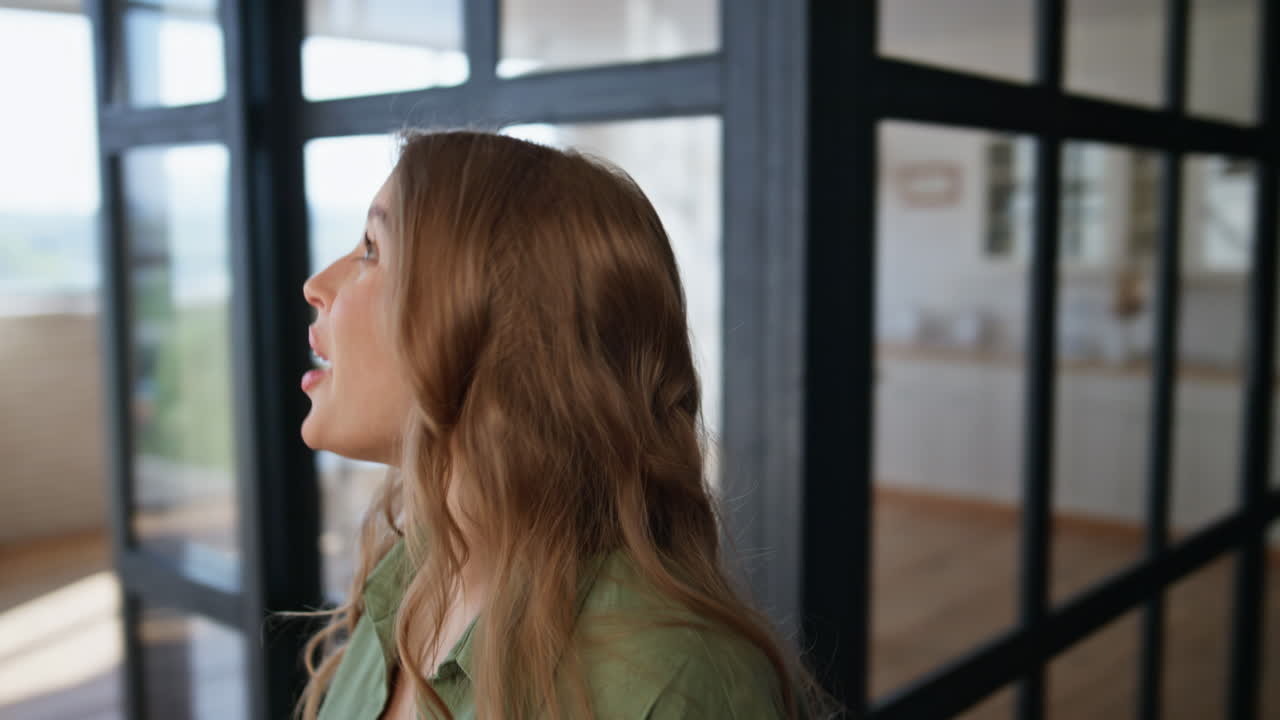 Man making surprise wife entering luxury home closeup. Surprised girl smiling