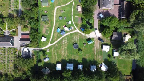 birdseye view of vehicle towing caravan entering a holiday park