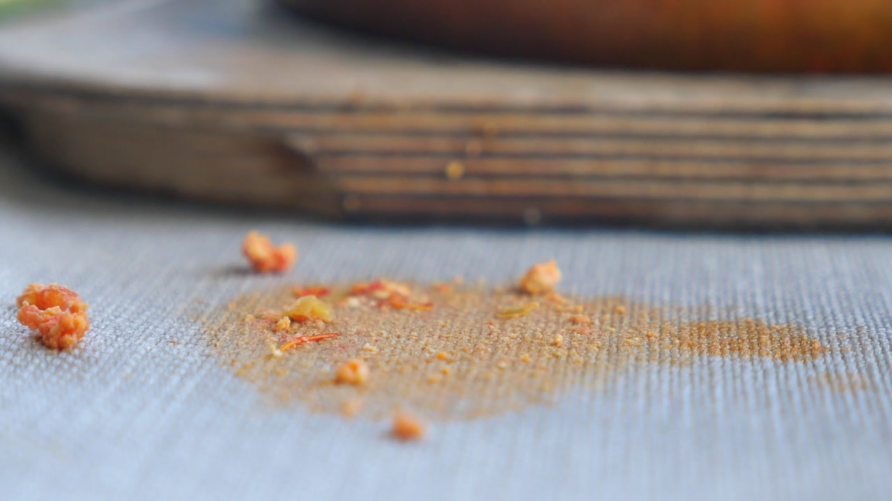 Close-up of Messy Food Crumbs and Stain on Fabric