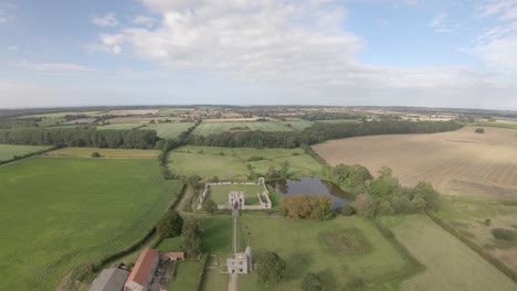 Aerial-Drone-Footage-of-the-ruins-of-Baconsthorpe-Old-Manor,-North-Norfolk