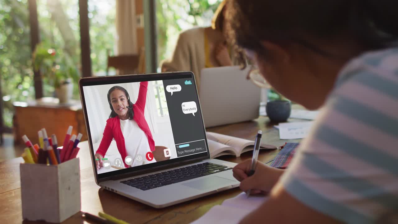 Composite video of girl using laptop for online lesson at home, with girl raising hand on screen