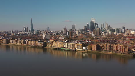 london, united kingdom, uk 04-03-2020: aerial view of the the thames river with london skyline